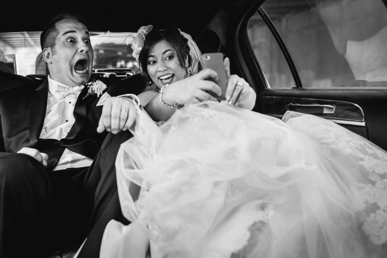 bride and groom taking a selfie