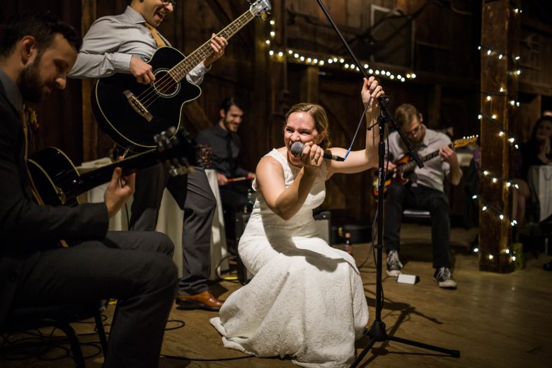 bride singing at her wedding reception