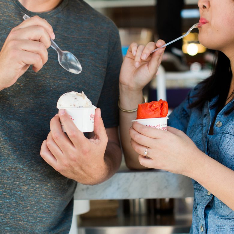 engaged couple eating ice cream