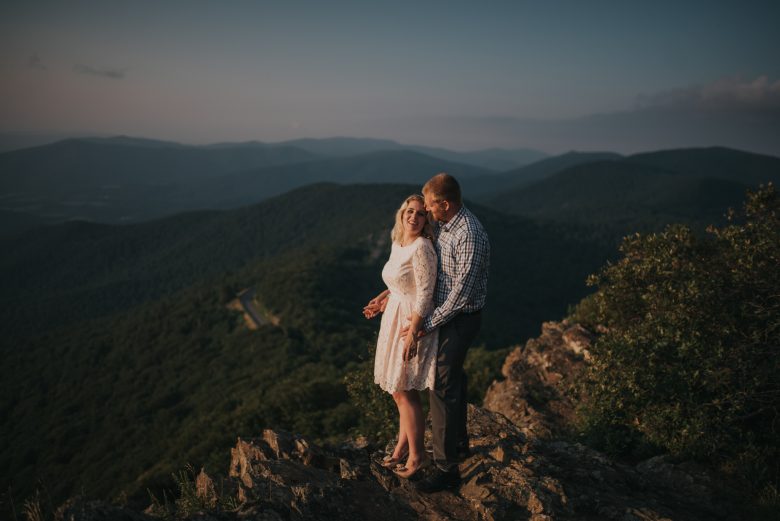 couple standing together on a mountain
