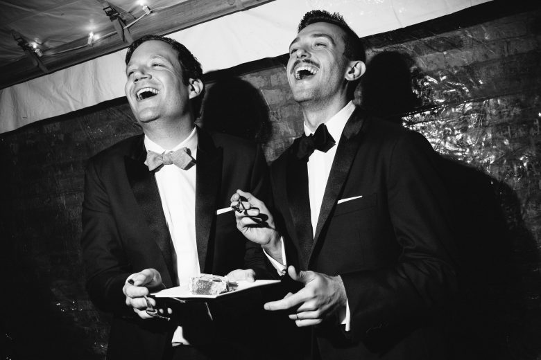 black and white photo of two grooms