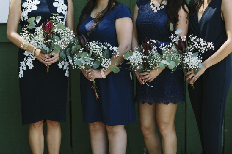 bridesmaids standing together in a row