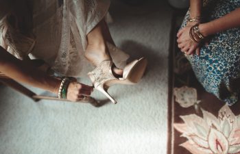 bride putting on her shoes