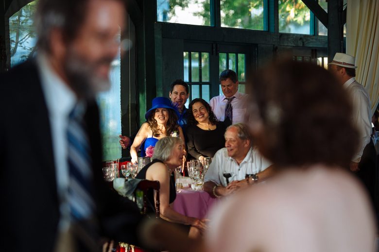 family laughing together at a wedding