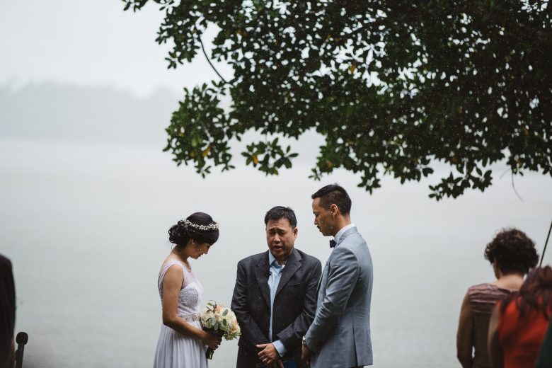 a couple during a rainy ceremony