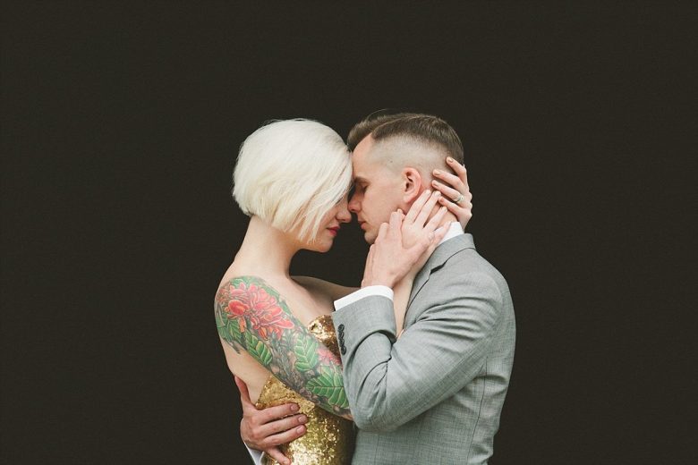 a tattooed couple on their wedding day