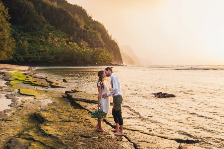 a couple kissing in hawaii
