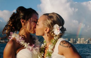 two women kissing at their wedding