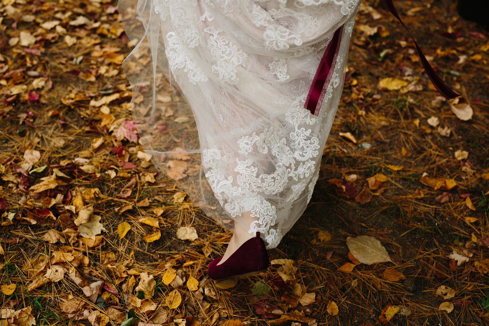 bride walking in leaves