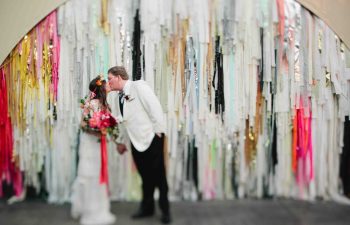 couple in front of the color condition background with wedding colors
