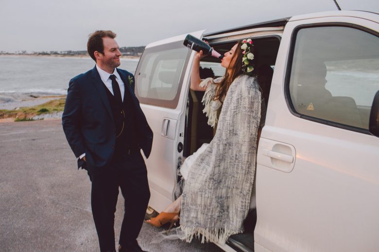bride drinking in a van