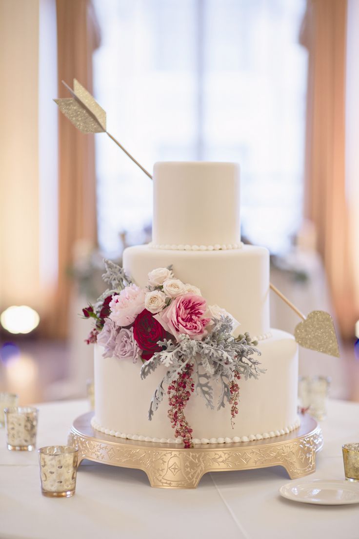 cake with flowers and an arrow