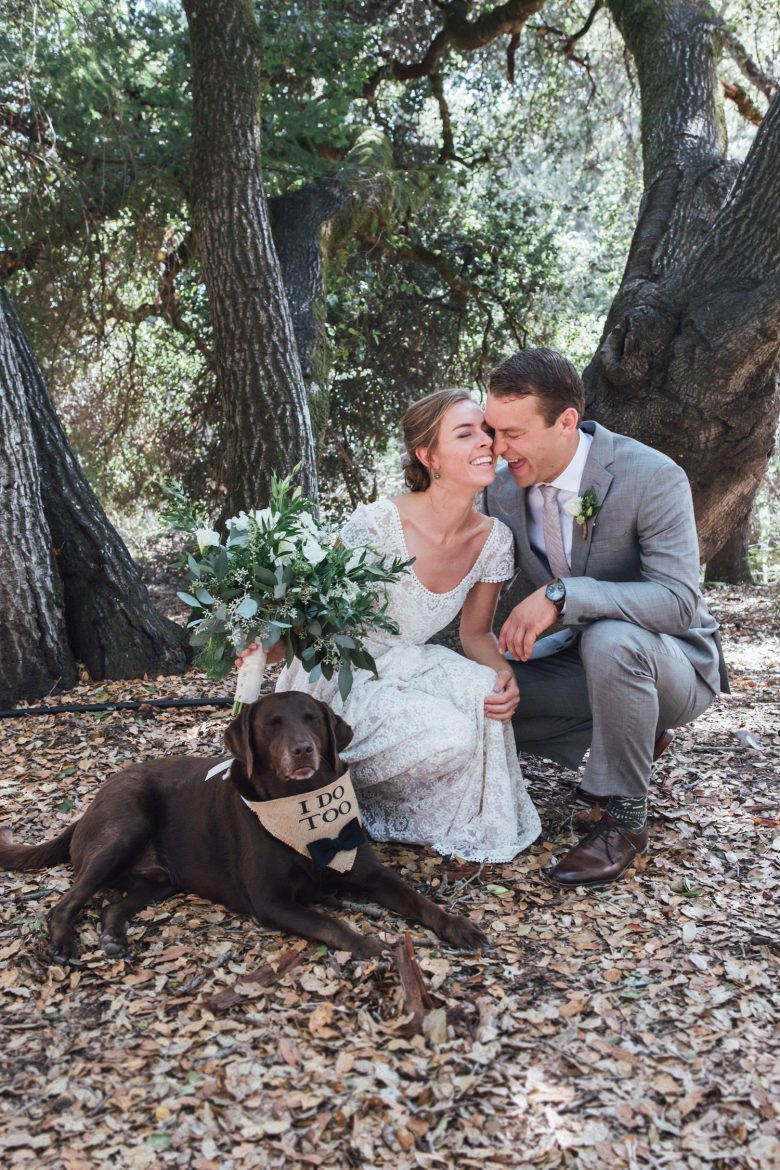 a bride and groom in a photo with their dog