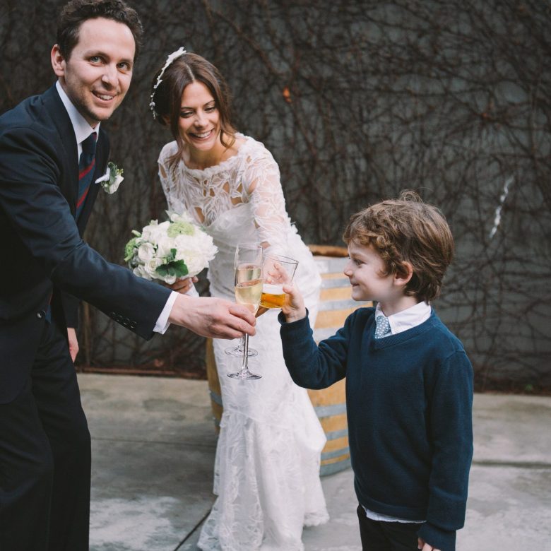 a couple and child celebrating their wedding