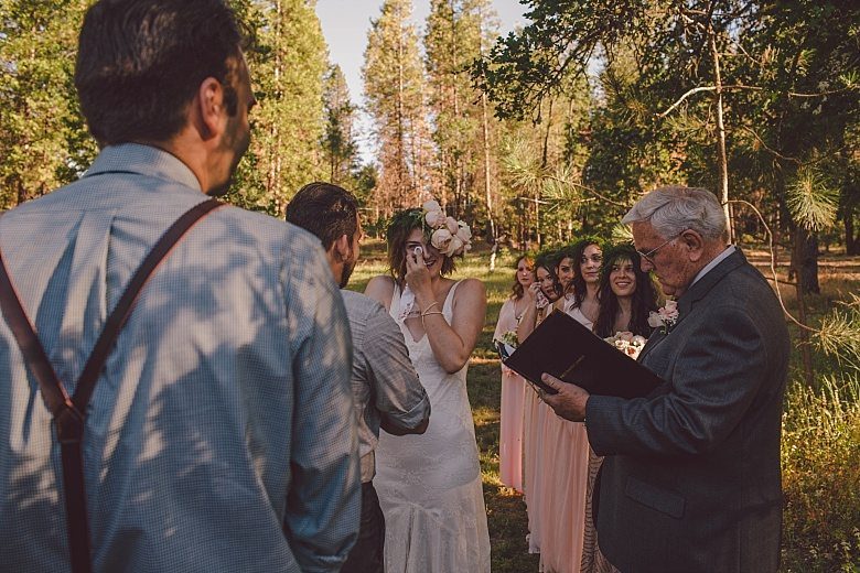 bride crying at the altar in a backyard in yosemite valley