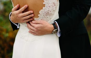 a bride and grom embracing