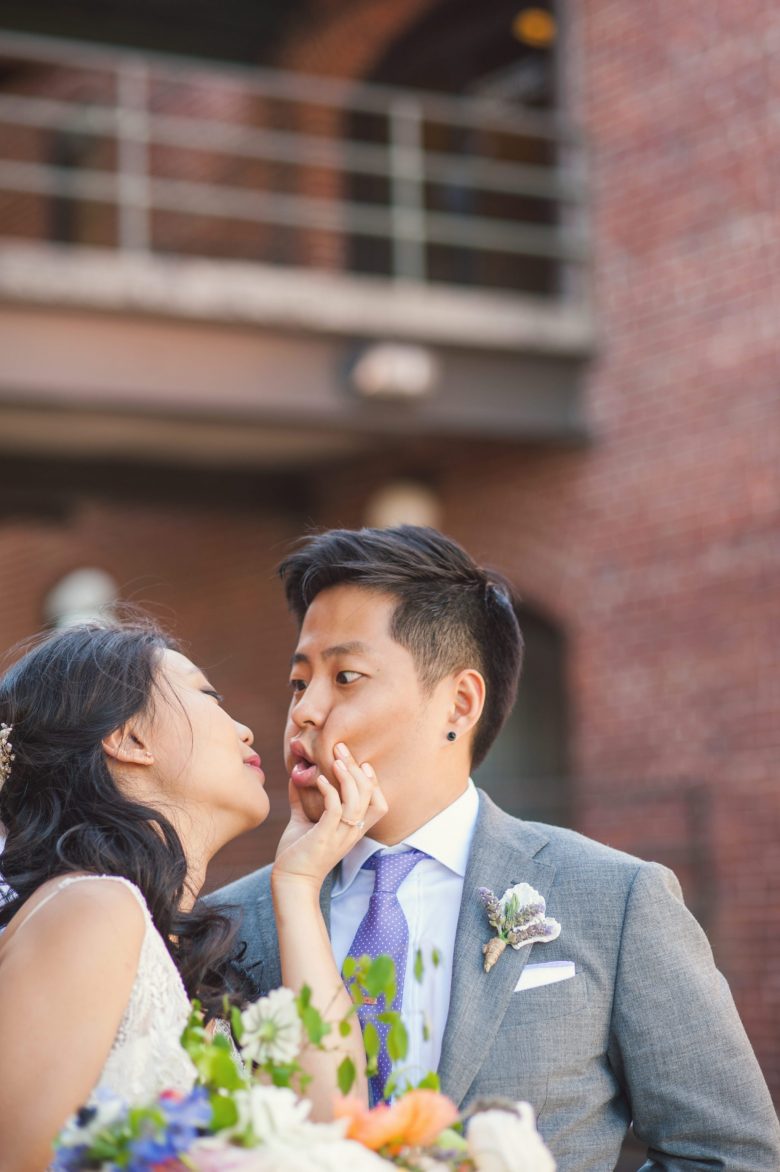 a couple making faces during their wedding