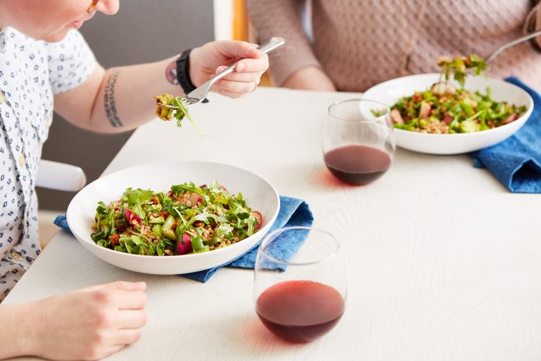 a couple eating a meal from blue apron