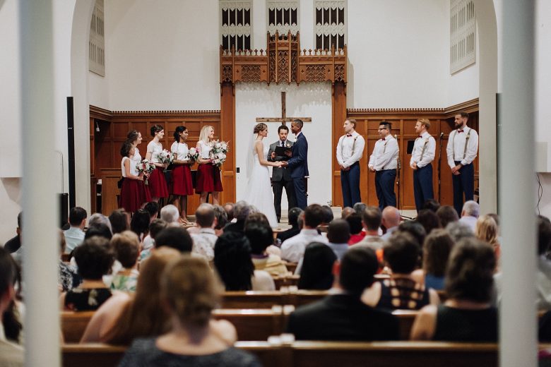 Wedding ceremony in church with bridesmaids and groomsmen