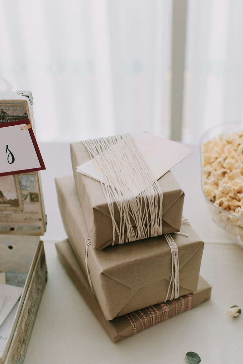 Brown paper packages tied up with string on the gift table