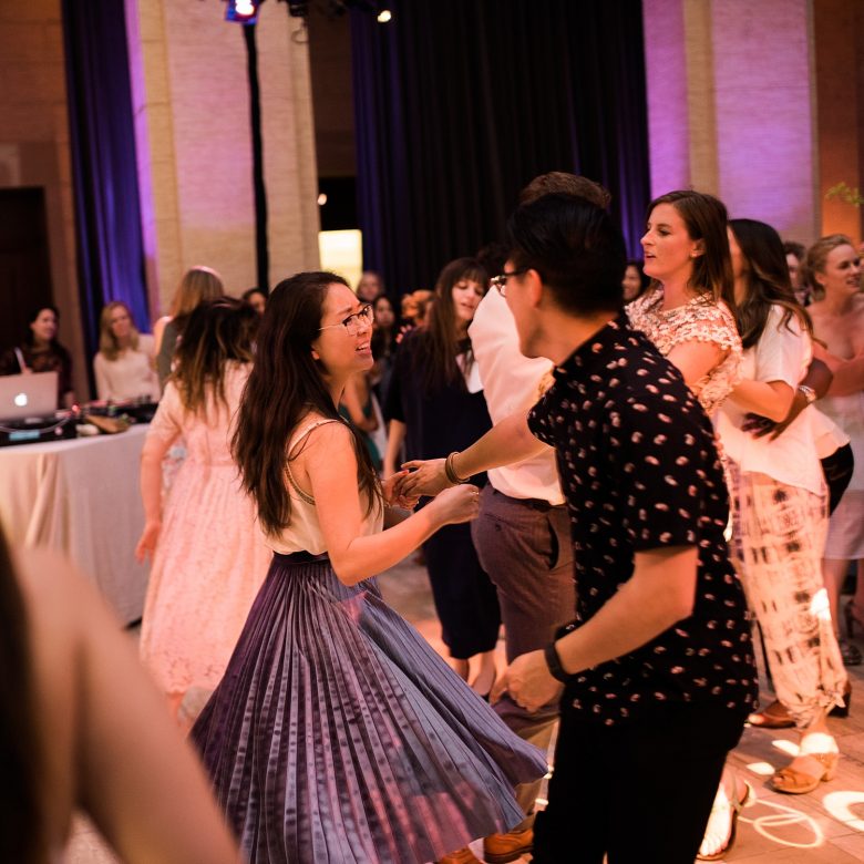 a couple dancing together at a wedding event