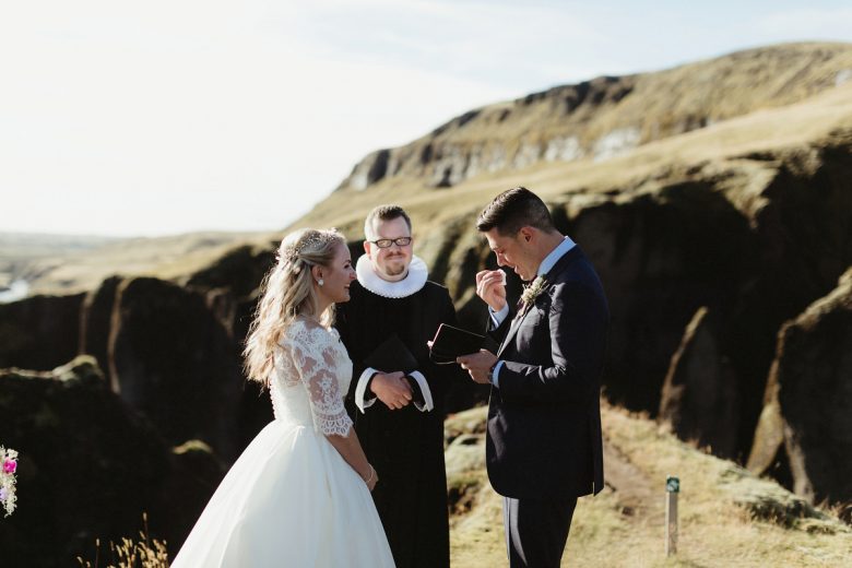Bride, groom, and officient in Fjaðrárgljúfur