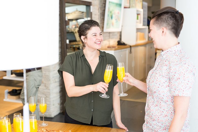 couple toasting at crate and barrel with mimosas in viv champagne glasses