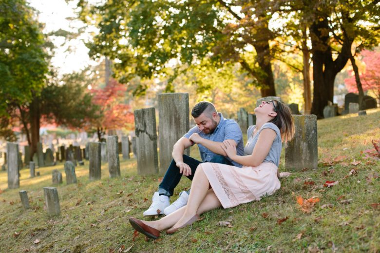 couple laughing in old cemetary