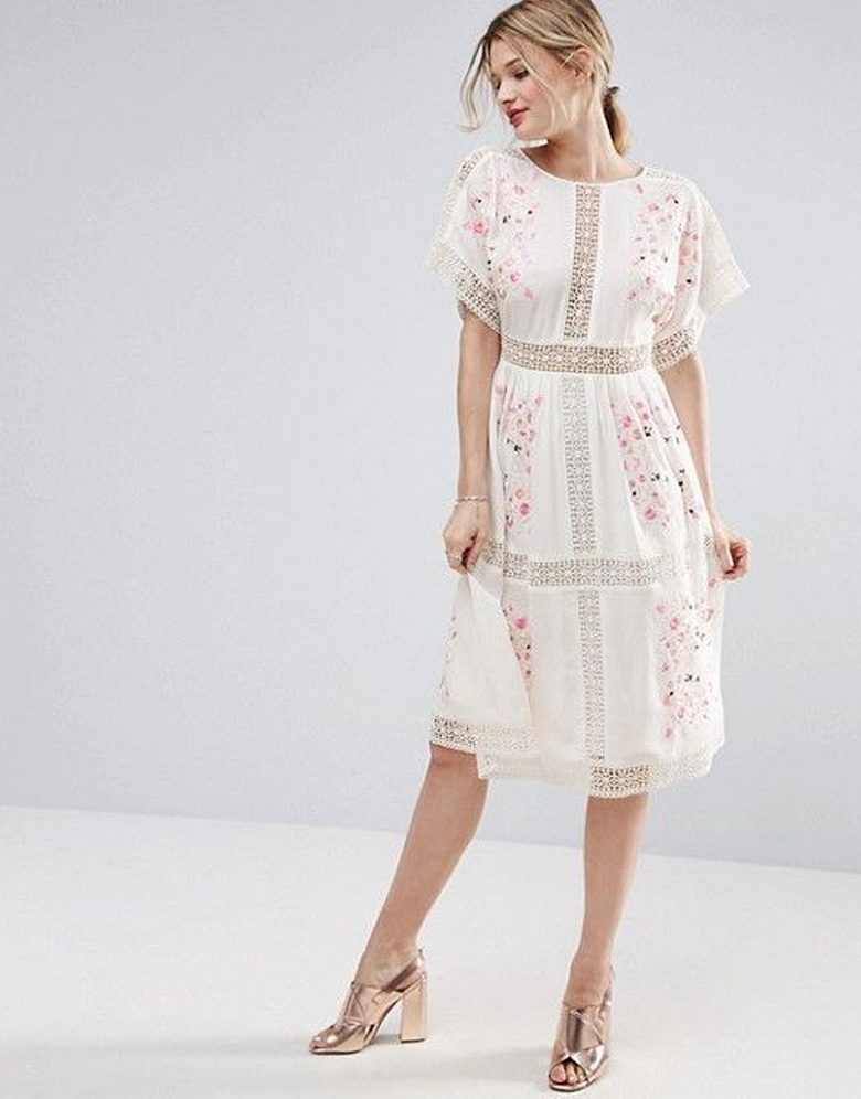 woman in white dress dress with crotchet lace stripes