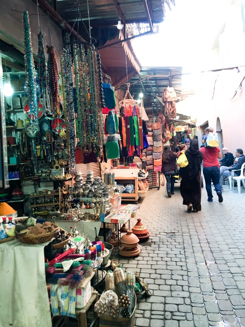 Scene from the sidewalk on a busy Marrakesh marketplace