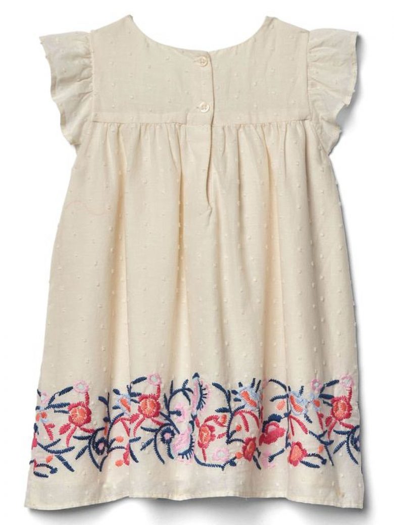 White toddler dress with embroidered hem