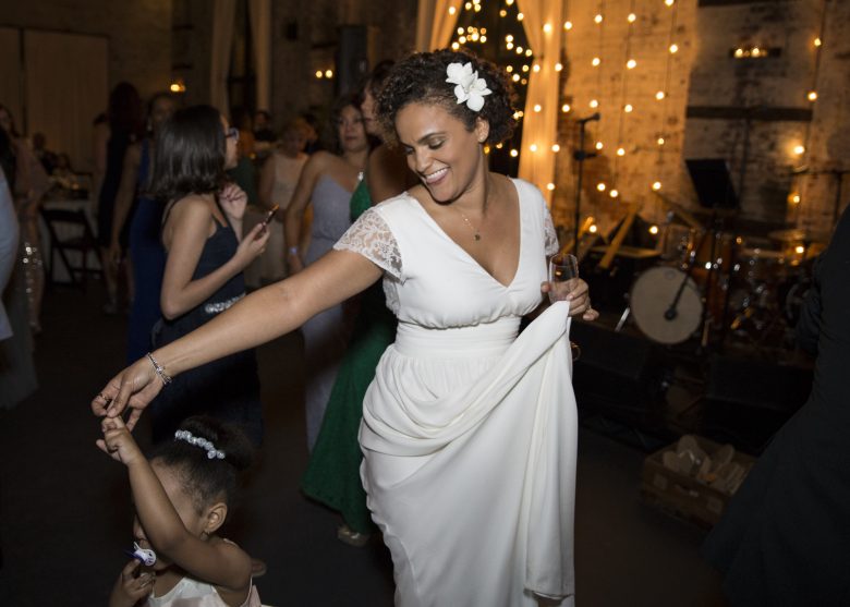 bride dancing with young girl
