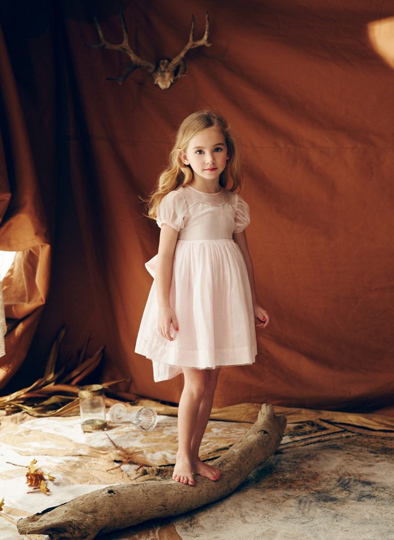 old fashioned pink dress on a little girl