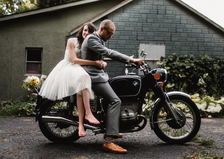 bride and groom on motorcycle