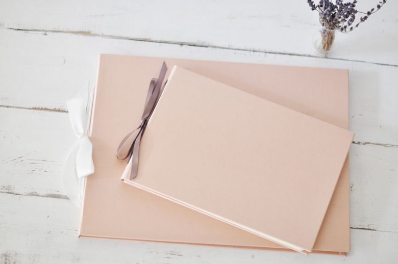 two soft pink instant wedding guest books