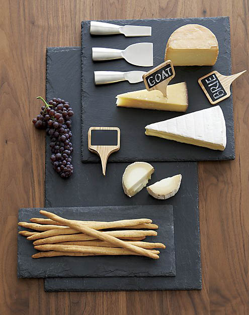 Slate Cheese Boards with cheese, grapes, breadsticks, utensils, and cheese signs