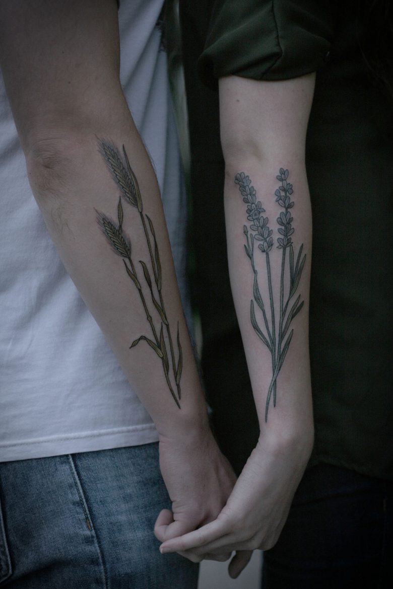 Barley and lavender tattoos on forearms