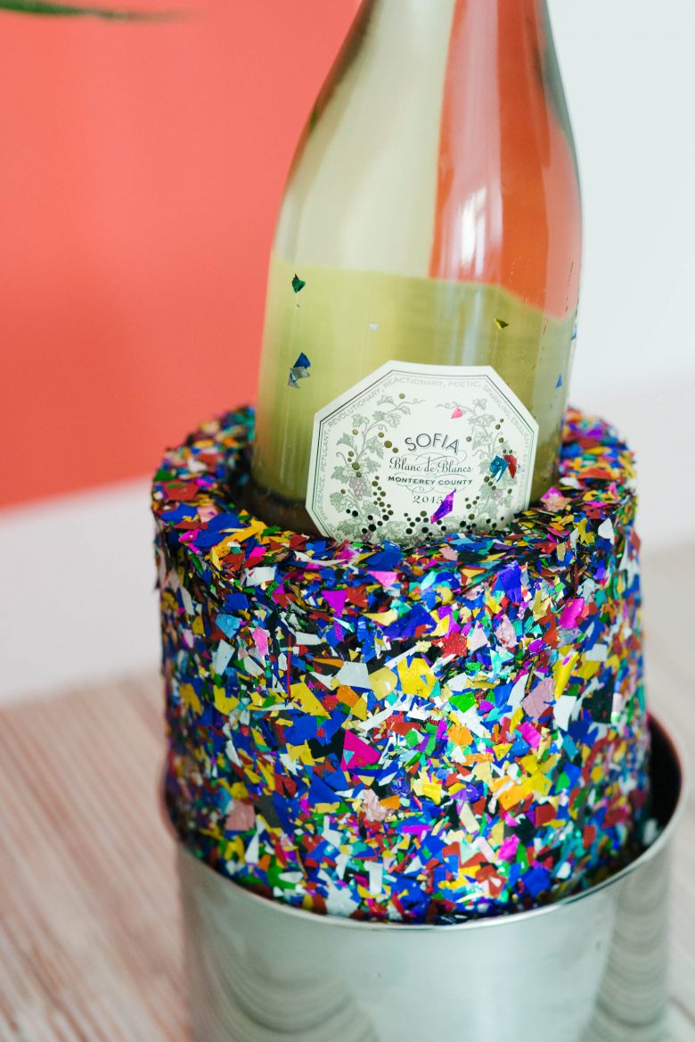 Bottle of Sofia Coppola Blanc de Blancs in confetti ice mould, in champagne bucket