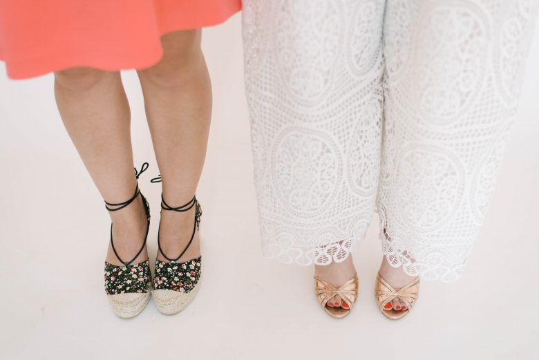 Two women wearings shoes