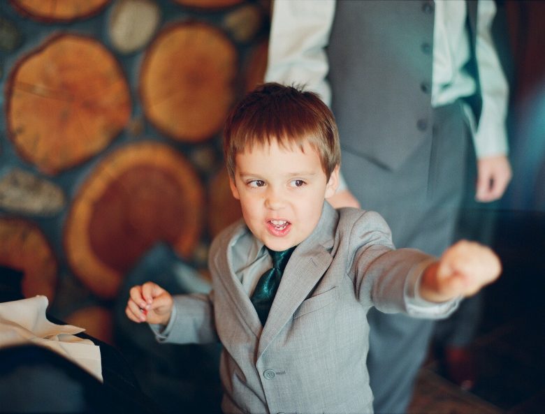 small boy in suit, tearing it up on the dance floor