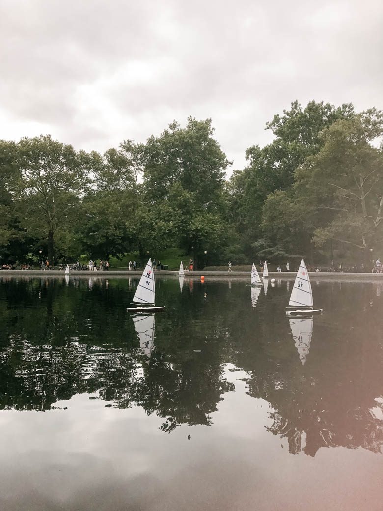 small sailboats on a lake at central park