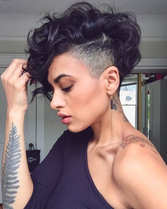 woman with dark hair and fade on side and short loose waves on top for a wedding hairstyle