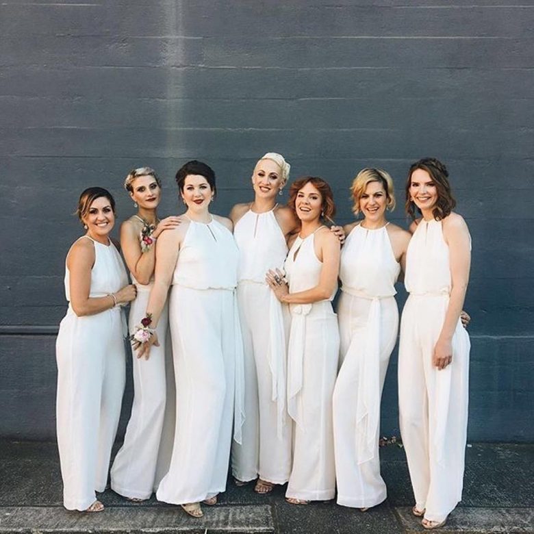 Women in white jumpsuits