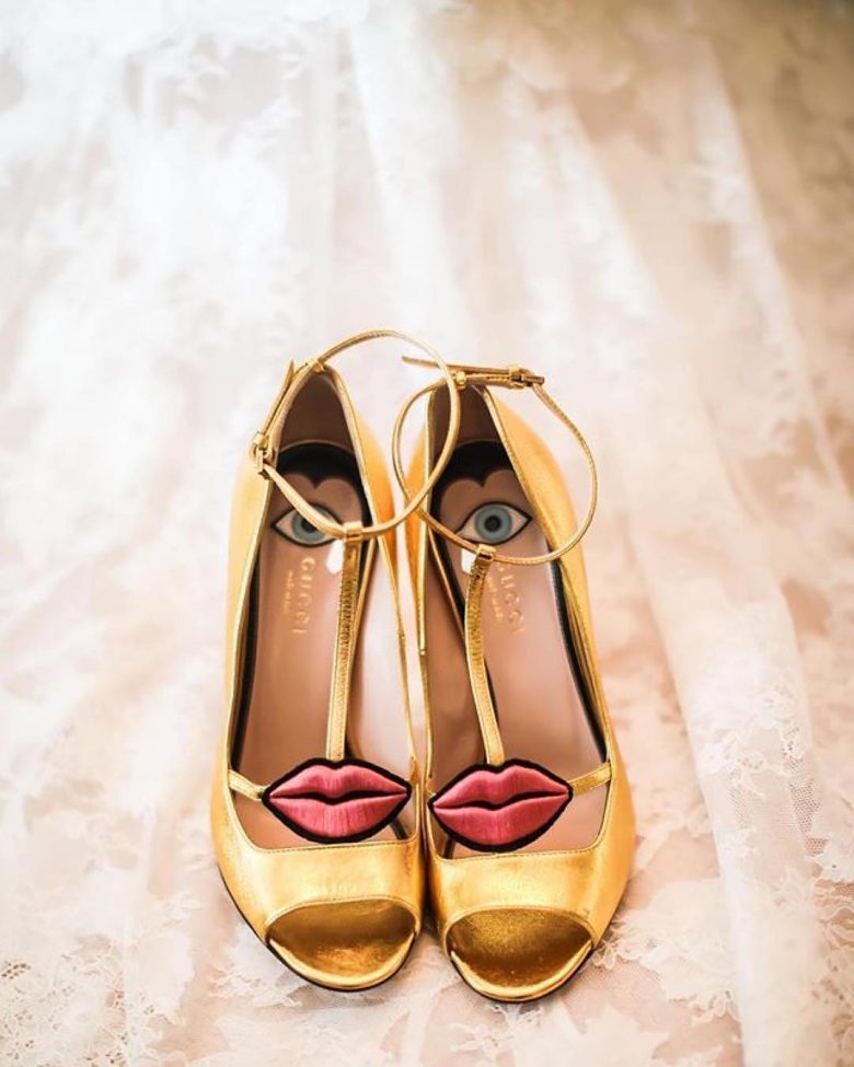 gold open-toed shoes with t-straps and lips