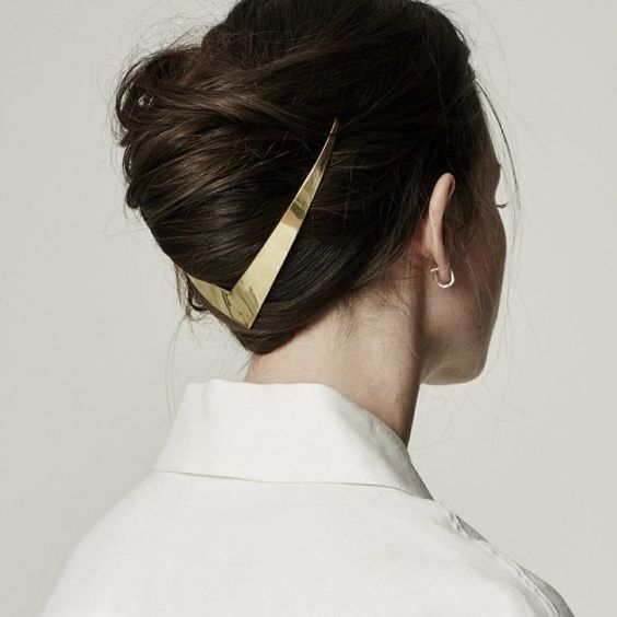 woman with a loose French twist accented with trek metal halo accessory for a wedding hairstyle