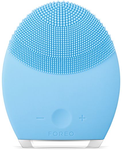 oval-shaped textured light blue face brush from Foreo