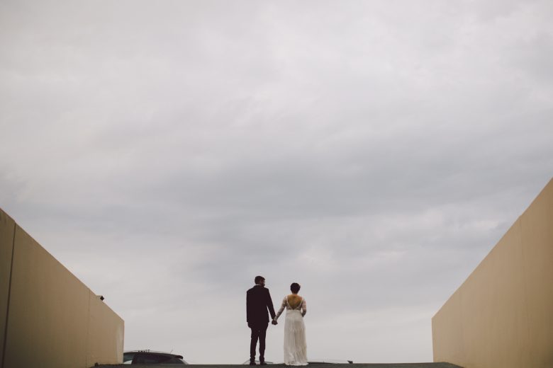 example of negative space where the couple is tiny in the frame and swallowed by the big sky