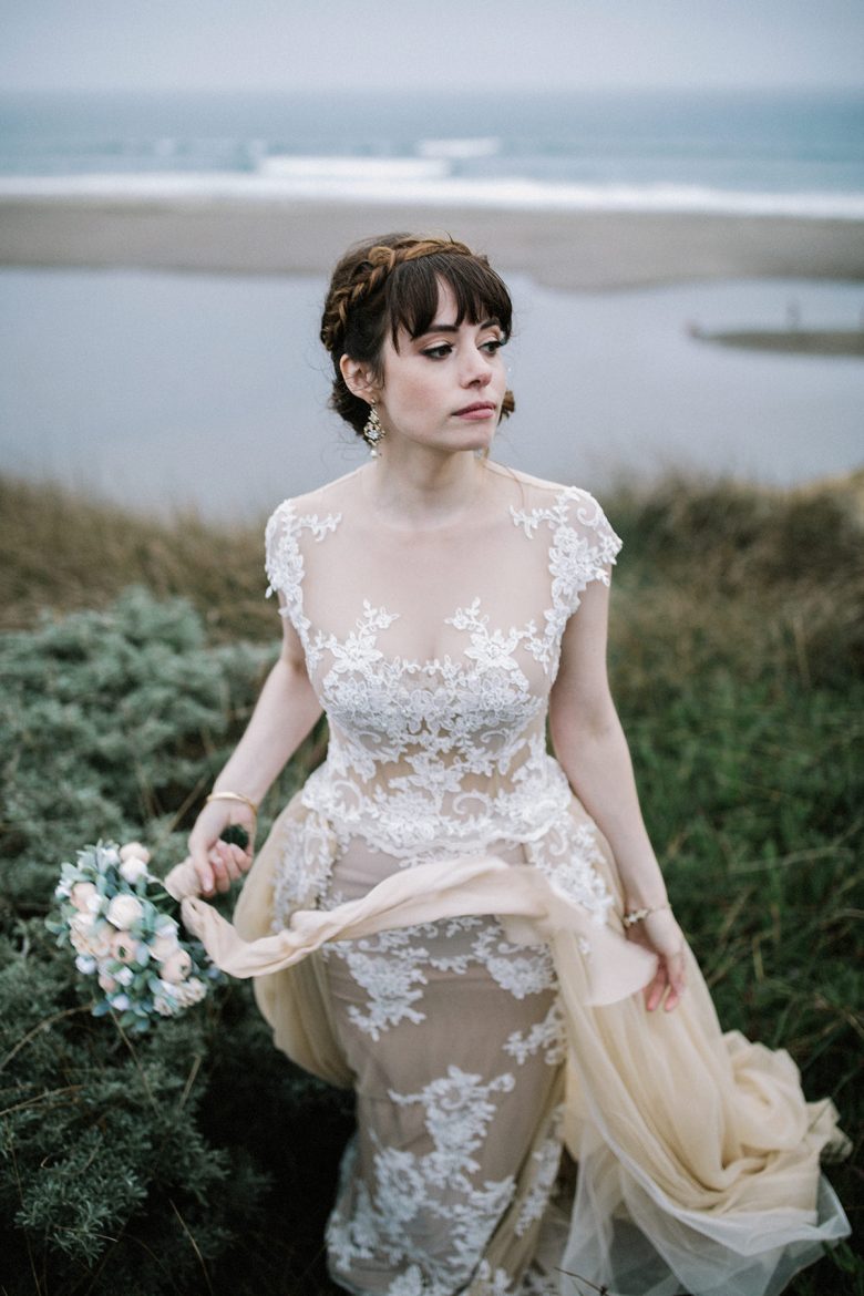 bride in a marsh with bouquet