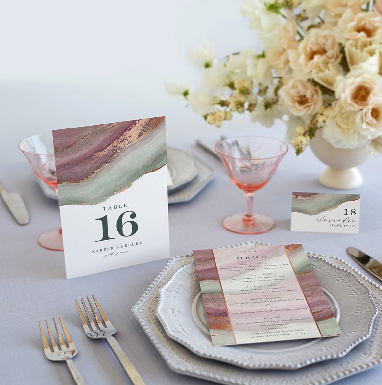 Wedding decorations featuring table setting with china, agate print table number, menu, and place card.