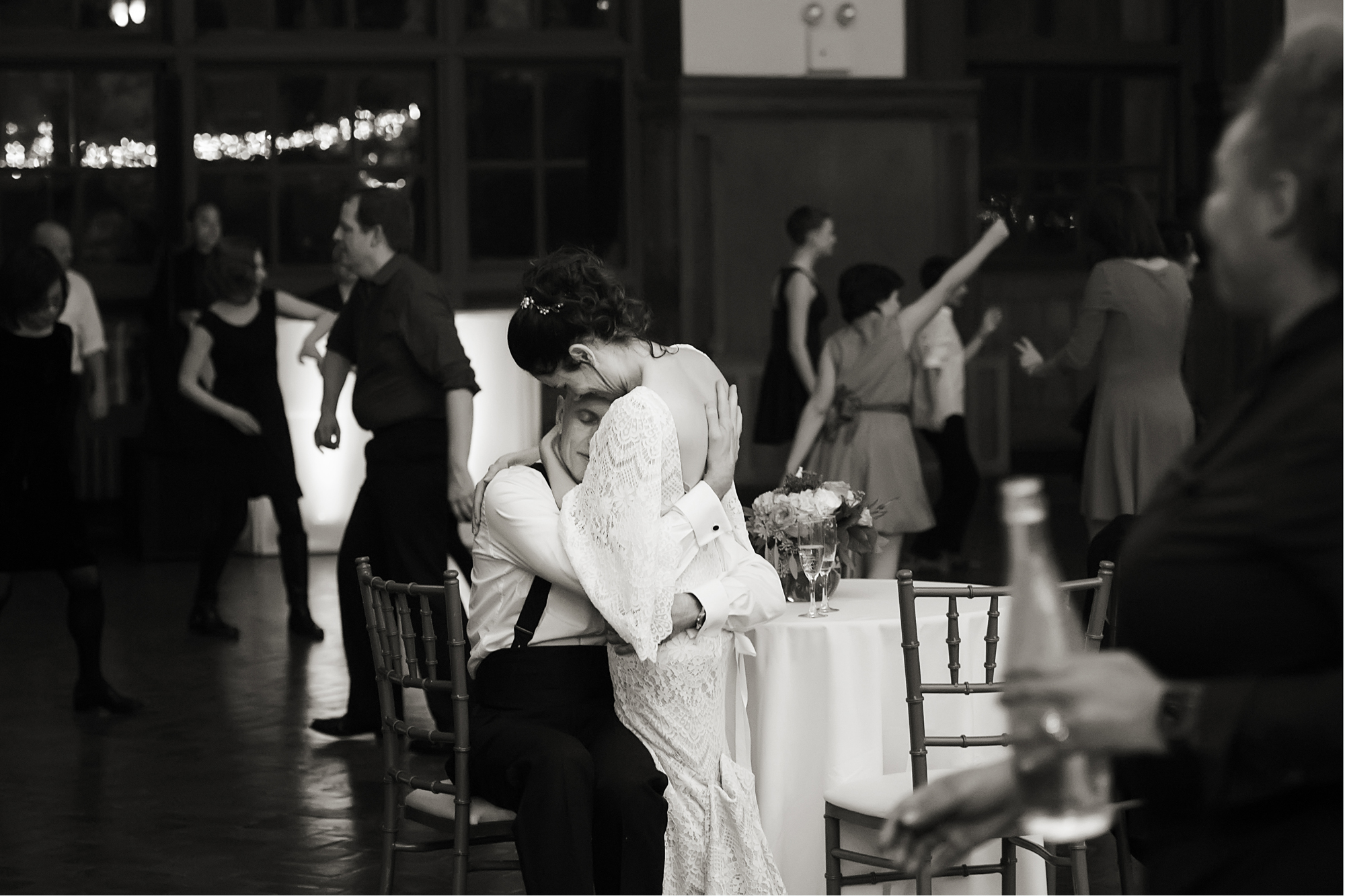 A wedding couple have quiet embrace during their wedding reception